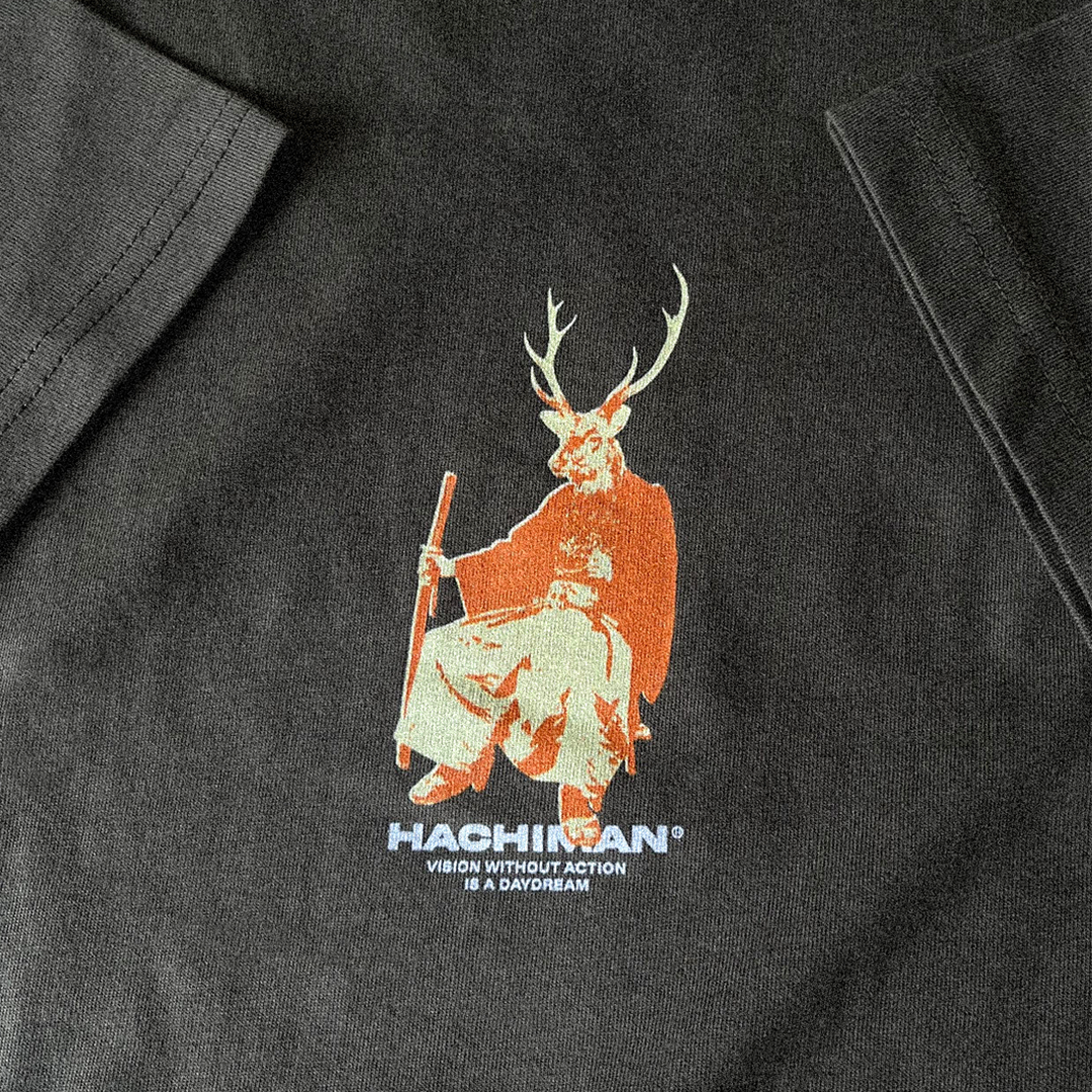 Khaki organic t-shirt with a Japanese graphic of a Sika Dear parading as a samurai. Close up.